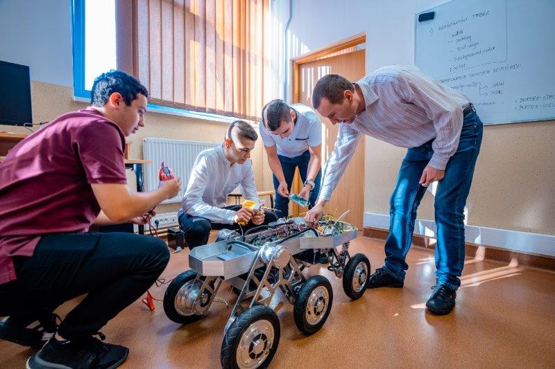 Students during workshops on building a robot model